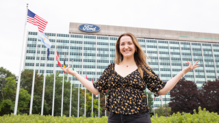 Caroline Tepper outside of the Ford World Headquarters building in Dearborn.