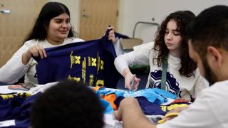 Photos of students Yasmin Gonzalez and Yaritza Campos at MLK Day of Service in 2024.