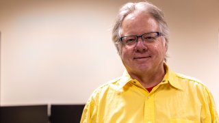 A headshot of Electrical and Computer Engineering Paul Watta wearing a yellow polo shirt